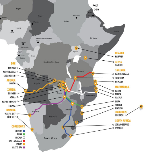 A black-and-white photograph of the pre-war Mombasa Resident Office (1929-1941), a colonial-style building with “MITCHELL COTTS AND CO LTD” written on its facade, and a statue of a man in the foreground.
