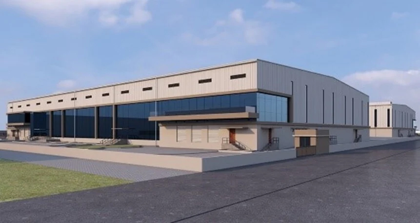 Architectural rendering of a modern logistics warehouse with large glass windows, loading docks, and wide surrounding pavement, under a clear blue sky.