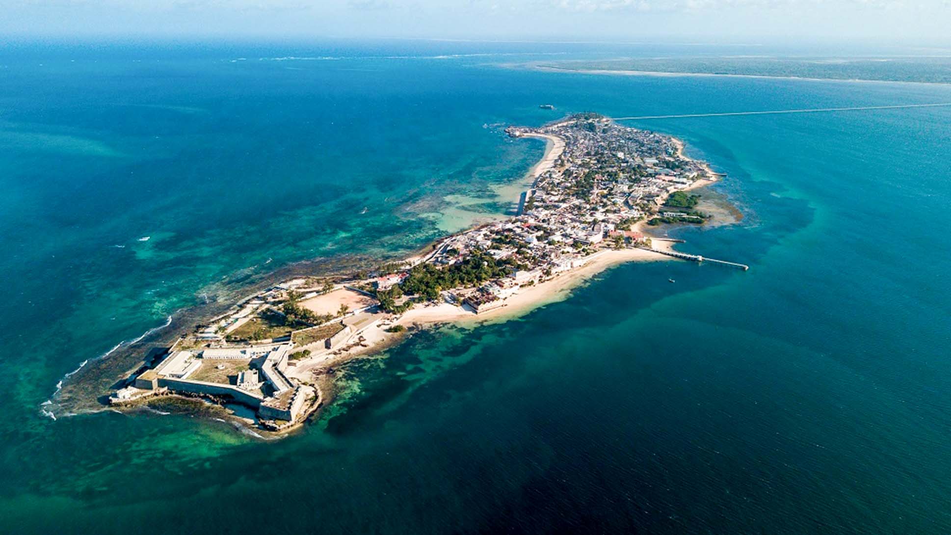 Aerial view of Ilha de Moçambique, showing its coral shoreline, urban area, and the connecting bridge to Nampula province.