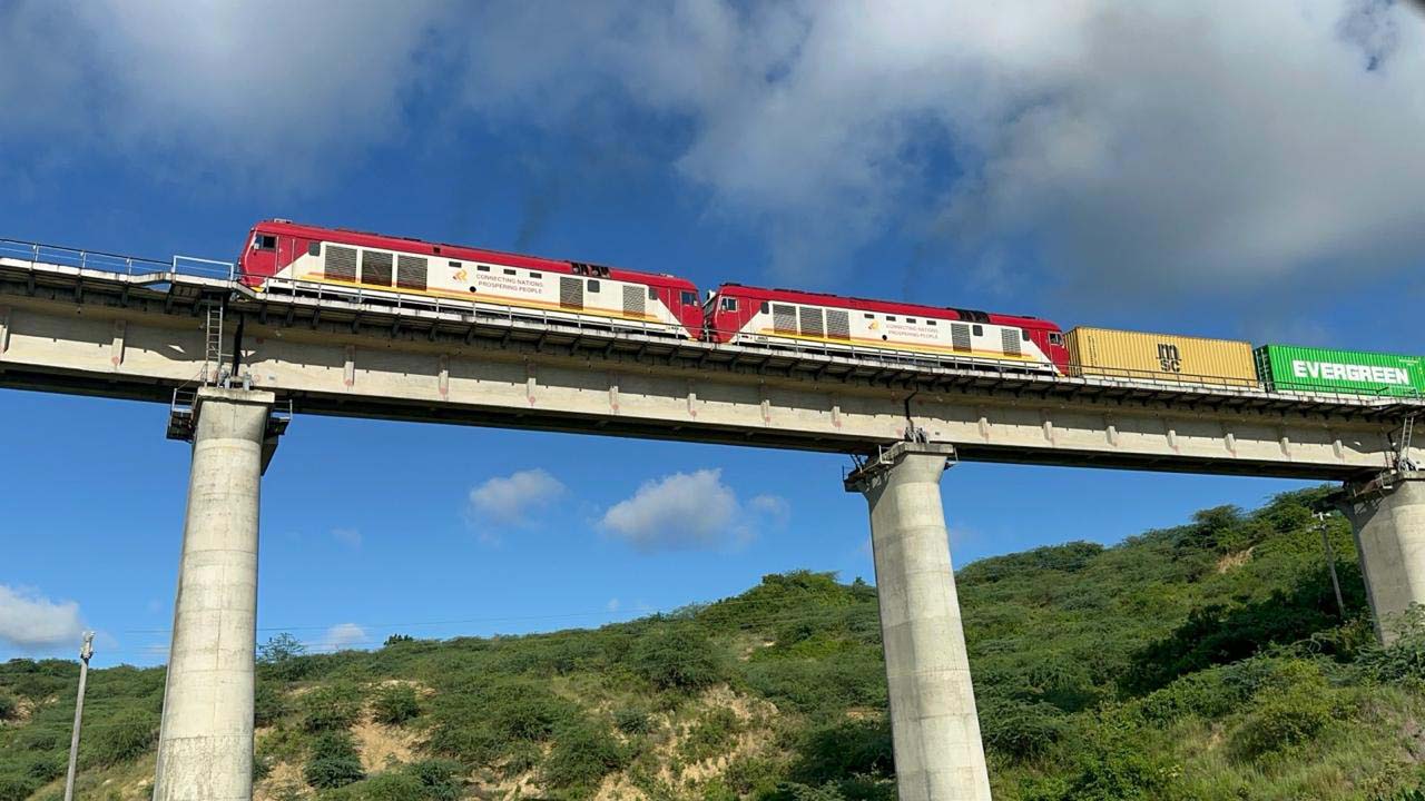 Kenya Standard Gauge Railway (SGR) freight train transporting containers across an elevated viaduct, strengthening inland rail connectivity from Mombasa Port.