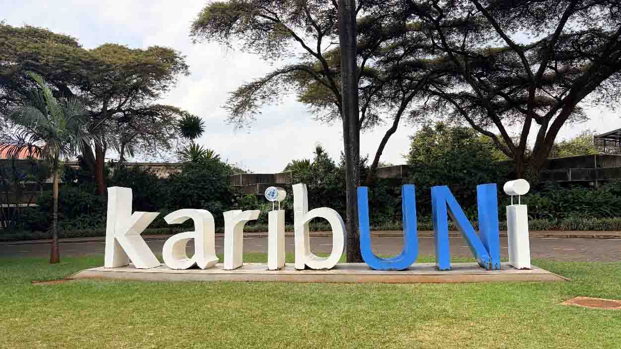 “KaribUNi” welcome sign displayed among trees and landscaped gardens at the United Nations Office in Nairobi.