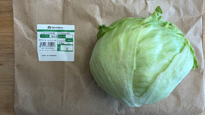 A head of iceberg lettuce with a supermarket price label in Nairobi