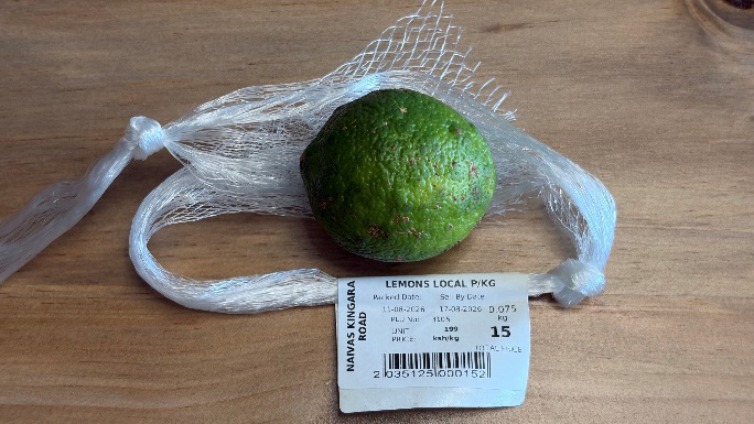 A locally grown Kenyan lemon with its supermarket price label