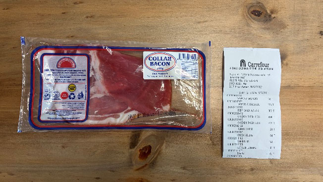 A package of bacon beside a supermarket receipt in Nairobi