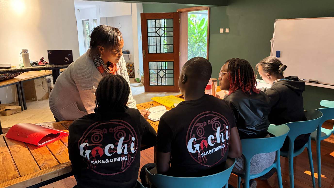 Japanese language students studying together with their instructor during an in-person class at Gochi Japanese Restaurant in Nairobi.