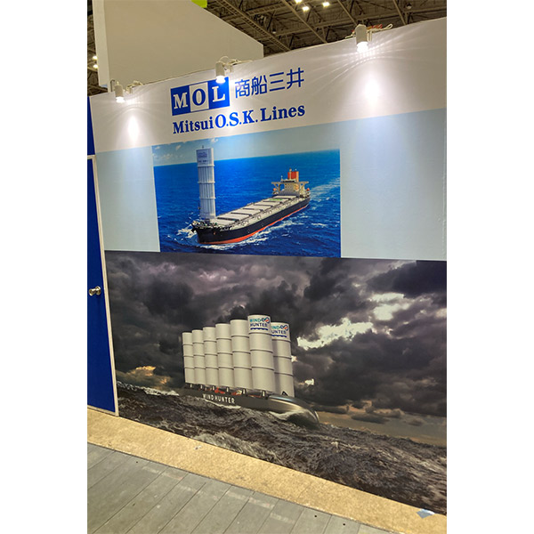 A wall display at MOL’s booth showing vessels equipped with wind propulsion technologies, including the Wind Challenger and Wind Hunter projects.