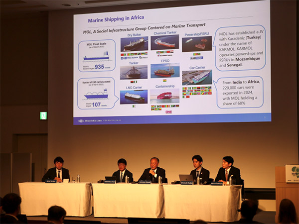A panel session featuring MOL executives presenting on marine shipping in Africa, with a large presentation slide showing MOL’s fleet and operations.